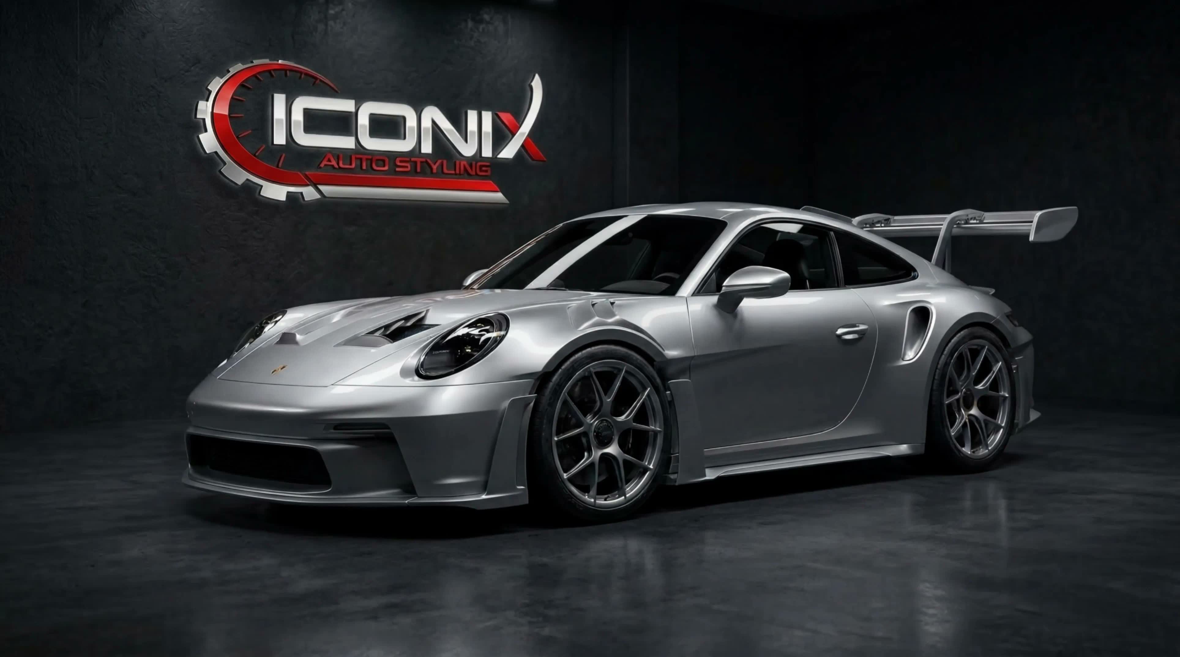Silver Porsche 911 GT3 RS under studio lighting at the Iconix Auto Styling unit