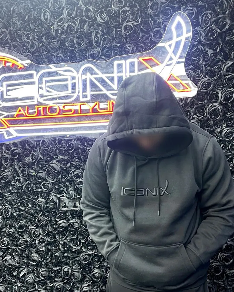 Iconix hoodie with black logo, worn in the Iconix studio